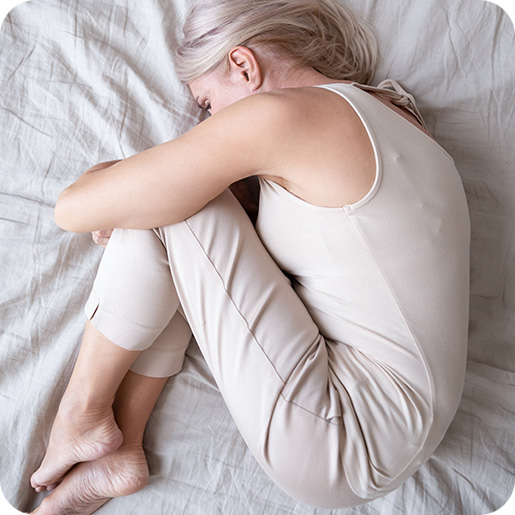 Photo of Depressed Woman in Fetal Position