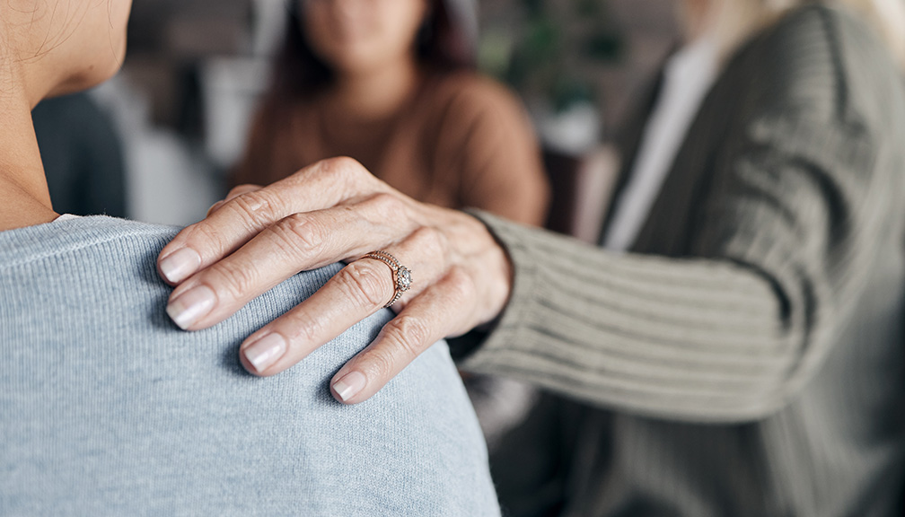 Photo of Elderly Woman's Supportive Hand on Shoulder