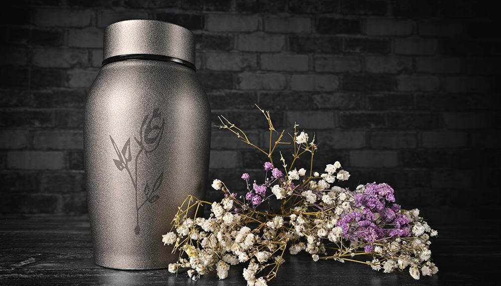 Photo of Beautifully Etched Urn and Flowers