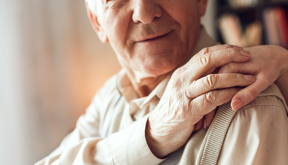 Photo of Elderly Man Being Comforted