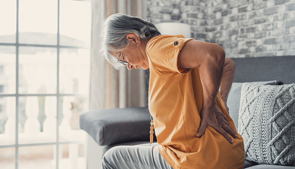 Photo of Woman in Physical (Lower Back) Pain