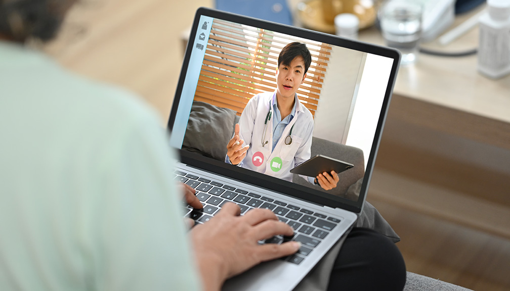 Photo of Woman Having a Telehealth Video Call