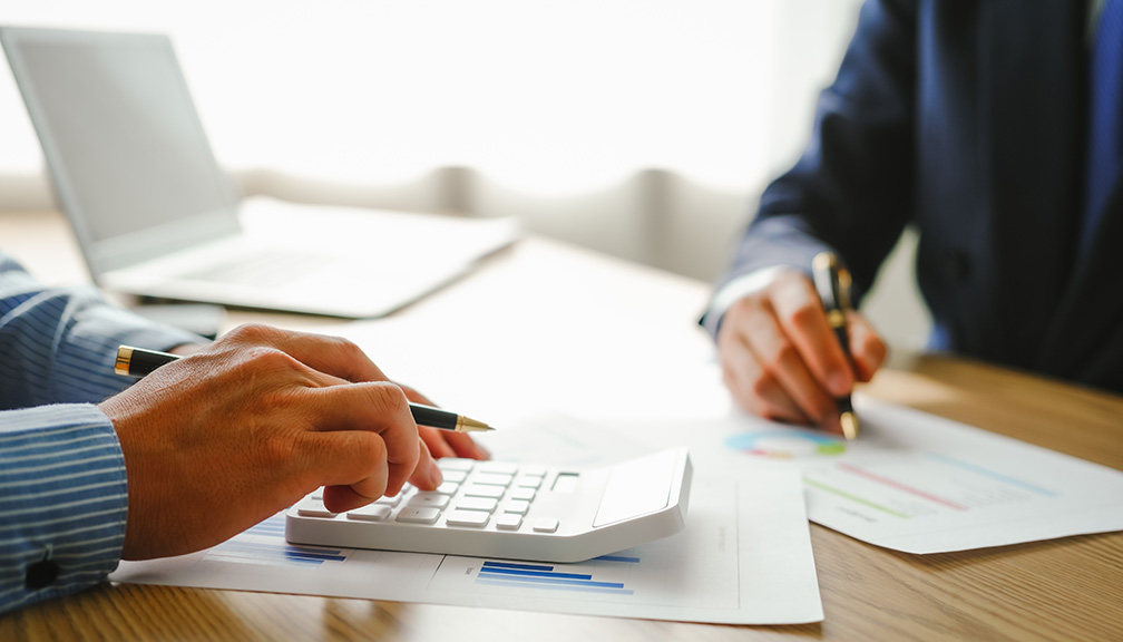 Photo of Man Working With Financial Advisor