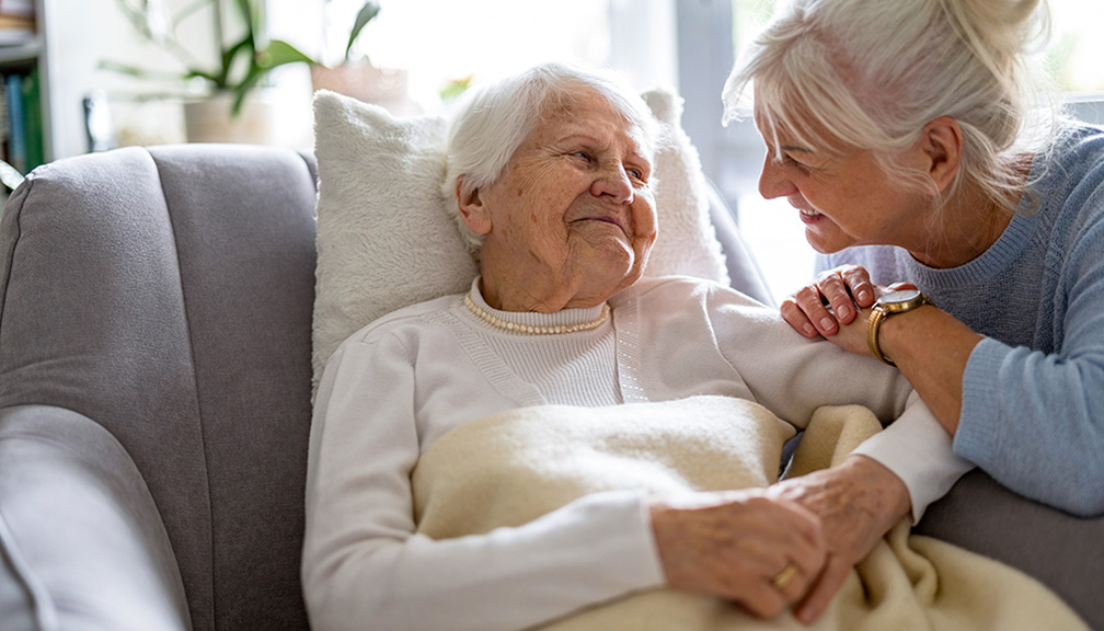 Photo of a Daughter Taking Care of an Elderly Mother at Home